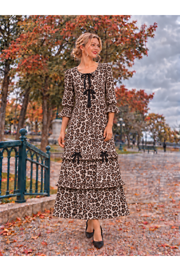 MD13277B-PL / Celeste Design<br/>Maxi leop dress with 3/4 sleeves with ruffle cuffs, and delicate bow accents down the bodice.